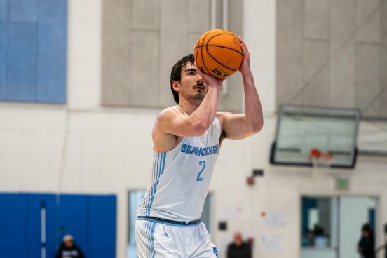 Basketball player shoots the ball