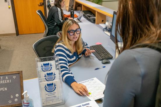 Student gets advice at an info desk
