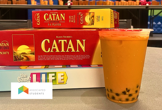 photo of board games and a cup of boba