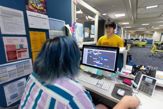 Student checking in at the LARC office