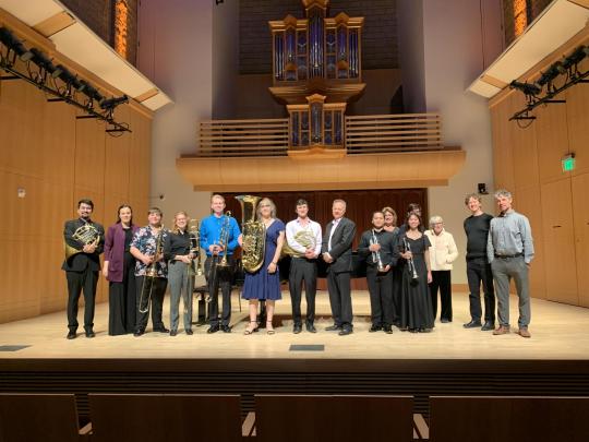 artists standing on stage