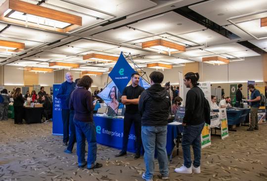 Students talking to an employer at a Career Fair