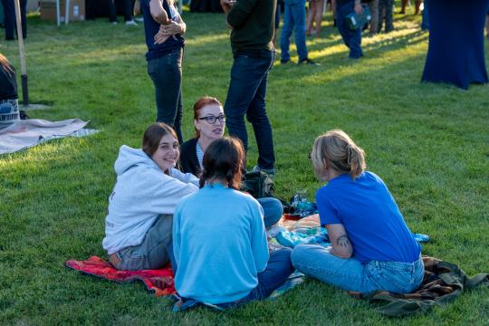 A group sits on the lawn