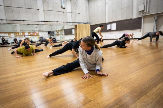 Students Stretching in Dance Studio