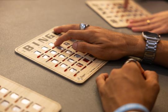 Student's hand on a bingo card