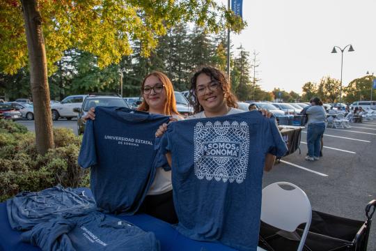 Students hold up 'Somos Sonoma' shirts
