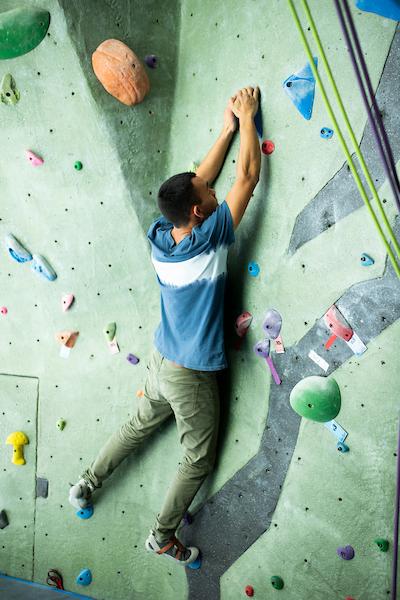 Person climbing on rock wall