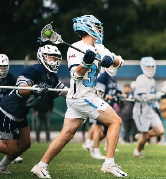Lacrosse player is about to launch the ball