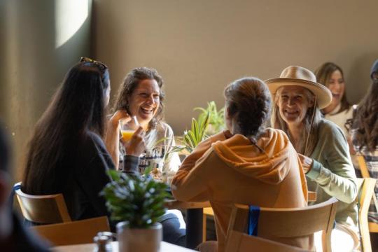 A group sits together eating brunch