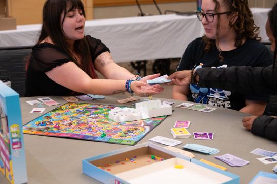 Group plays a board game together
