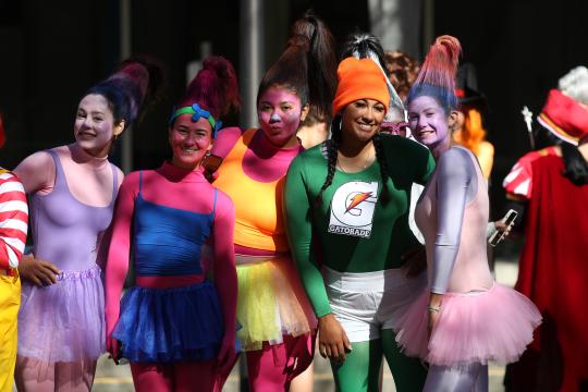 Students pose in halloween costumes
