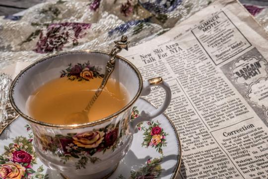 Teacup and newspaper