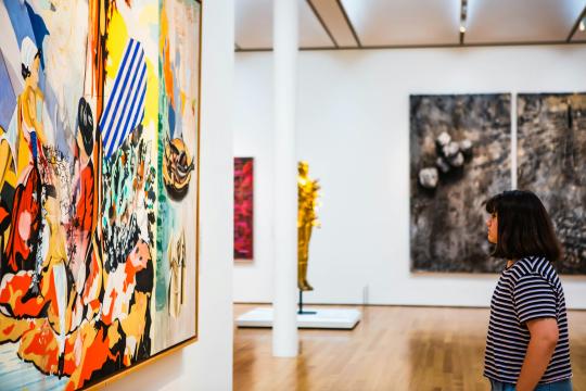 Student looks at a piece of modern art