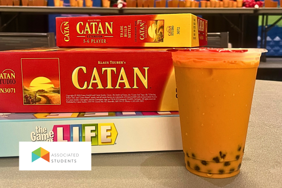 photo of board games and a cup of boba