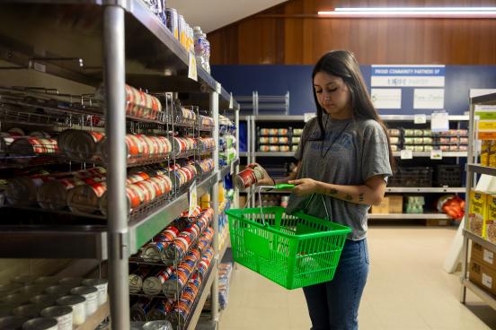 Student grabbing food from the lobos pantry