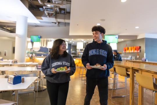 2 Students having lunch in between classes