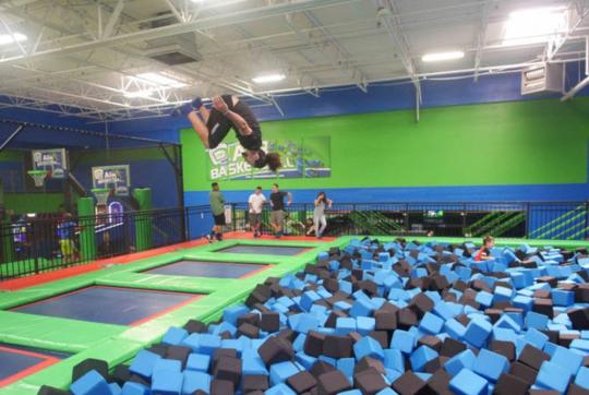 College student jumping at rebounderz
