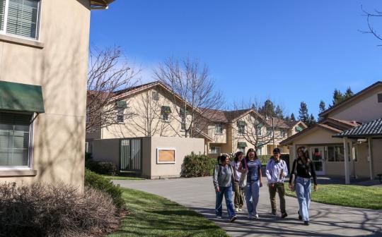 Group of SSU students walking around dorms