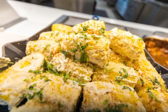 Mexican style corn on the cob served at the kitchens