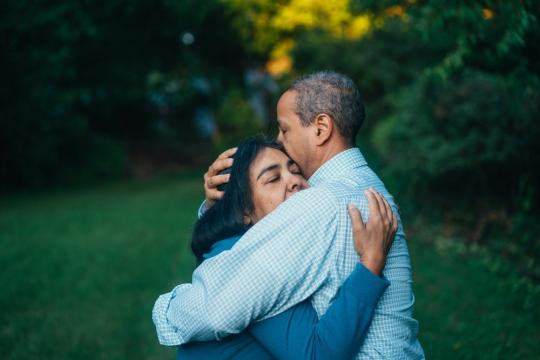 Couple hugging in relief