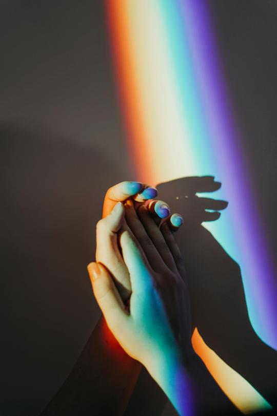 LGBTQ couple holding hands