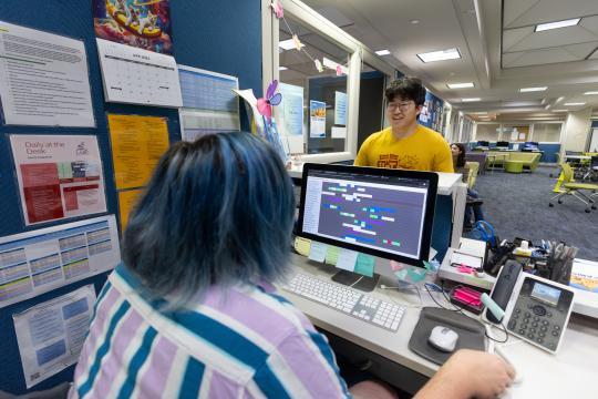 Student checking in at the LARC office