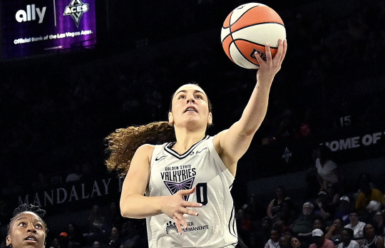 Valkyries' player jumping with a basketball