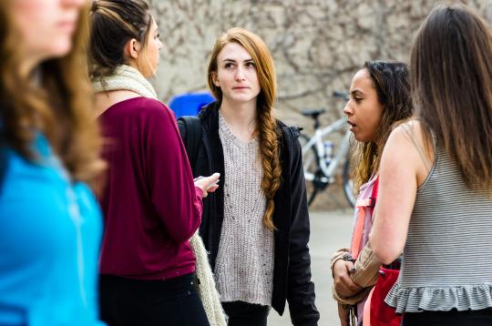 Group of women having a conversation outside GMC