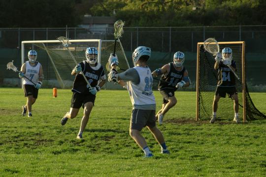 men playing lacrosse