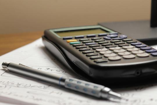 calculator and pen 