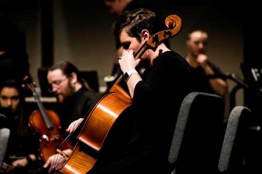man playing instrument 