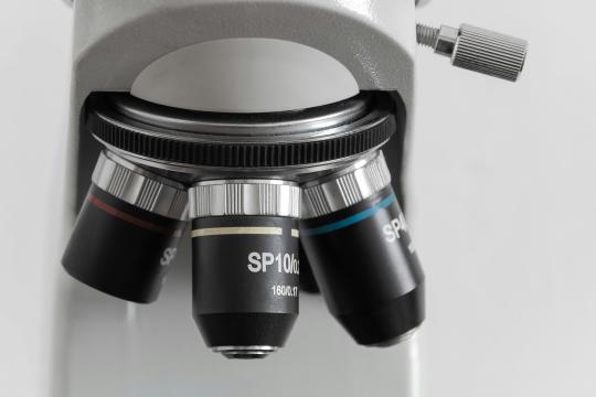 front of a microscope