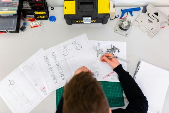 Man making blueprints